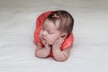 Beautiful newborn baby sleeping on her elbows and hands Royalty Free Stock Photo