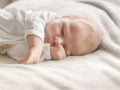 Beautiful newborn boy sleeping with his arms crossed Royalty Free Stock Photo