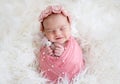 Beautiful newborn smiling in dream