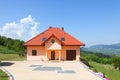 A beautiful newly built house. Yard with green grass and driveway