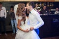 Beautiful newlywed couple first dance at wedding reception surrounded by smoke and blue