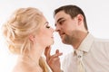 Beautiful newlywed couple in wedding attire are kissing Royalty Free Stock Photo
