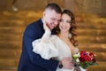 A beautiful newlyweds with a bouquet. bride gently strokes the groom on the face