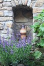 Beautiful niche with amphora in stone wall of the garden Royalty Free Stock Photo