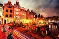 Beautiful night in Amsterdam. illumination of buildings an Royalty Free Stock Photo