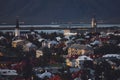 Beautiful night dusk view of Reykjavik, Iceland, aerial view with Hallgrimskirkja lutheran church, with scenery beyond the city, Royalty Free Stock Photo