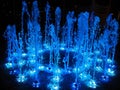 Beautiful night fountain on the square with interesting blue colors,night colors Royalty Free Stock Photo