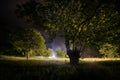 Beautiful night landscape of big full moon rising over the mountain road with hill and trees, mystical concept Royalty Free Stock Photo