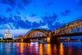 Beautiful night landscape of the Cologne, Germany with gothic cathedral, Hohenzollern Bridge and reflections over the River Rhine Royalty Free Stock Photo