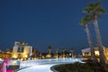 Beautiful night landscape view of hotel area. Lighting, trees, swimming pool modern buildings on dark sky background. Royalty Free Stock Photo