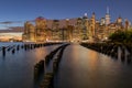 Beautiful Night Light and Lower Manhattan skyline with East River and New York City. Twilight with Reflections and Abandoned Pier