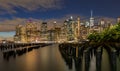 Beautiful Night Light and Lower Manhattan skyline with East River and New York City. Twilight with Reflections and Abandoned Pier Royalty Free Stock Photo