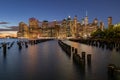 Beautiful Night Light and Lower Manhattan skyline with East River and New York City. Twilight with Reflections and Abandoned Pier Royalty Free Stock Photo