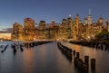 Beautiful Night Light and Lower Manhattan skyline with East River and New York City. Twilight with Reflections and Abandoned Pier Royalty Free Stock Photo