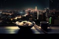 beautiful night scene with view of the city, with ramen bowl and chopsticks in the foreground