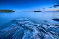 Blue moment in the rocky seashore Royalty Free Stock Photo