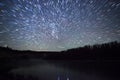 Beautiful night sky, the Milky Way, star trails and the trees Royalty Free Stock Photo