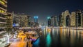 View of Dubai Marina Towers and yahct in Dubai at night timelapse hyperlapse Royalty Free Stock Photo