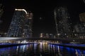 beautiful night view of dubai marina skyscrapers from the water side on the river. Bridge in Dubai Marina illuminated at Royalty Free Stock Photo
