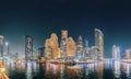 Beautiful Night view of high-rise buildings of residential district in Dubai Marina And Tourist Boat, Sightseeing Boat Royalty Free Stock Photo