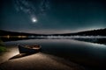 Beautiful night view of the lake with a boat on the shore