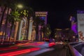 Beautiful night view of Las Vegas, with blurred car lights tracing along the Strip road.