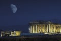 Nightview of Parthenon Temple and a big moon from Filopappou Hill, Athens, Greece