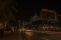 Beautiful night view of Miami Beach cityscape with stunning defocused light trails from cars on Collins Avenue.