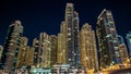 View of Dubai Marina Towers and yahct in Dubai at night timelapse hyperlapse Royalty Free Stock Photo