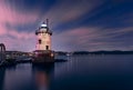 Beautiful night view of the Tarrytown Lighthouse in Sleepy Hollow, NY, with long exposure clouds