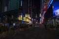 Beautiful night view of Time Square on Broadway in New York with people walking around. Royalty Free Stock Photo