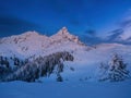 Beautiful night winter landscape in the mountains. Vibrant night sky with stars and clouds Royalty Free Stock Photo