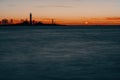 Beautiful nightly seascape with lighthouse and moody sky at the sunset