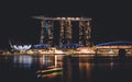 Beautiful nightscape of Marina Bay Sands in Singapore illuminated with glowing lights.