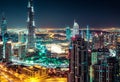 Beautiful nighttime Dubai skyline with modern skyscrapers.