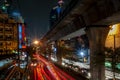 Beautiful nighttime image of traffic on Sukhumvit Road with long colored trails of moving car lights, Bangkok, Thailand