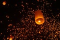 Beautiful nighttime shot of flying paper lanterns during the Yi Peng festival in Thailand