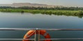 The beautiful Nile River with Luxor Mountain seen from a luxury cruise ship in Egypt. Royalty Free Stock Photo