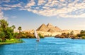 Beautiful Nile scenery with sailboat in the Nile on the way to pyramids, Aswan, Egypt