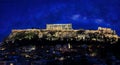 The Acropolis of Athens, Greece, with the Parthenon Temple on top of the hill in the night with a milky way Royalty Free Stock Photo