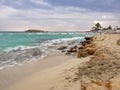 Beautiful Nissi beach with rolling sea with waves on a cloudy murky day in Ayia Napa, Cyprus Royalty Free Stock Photo
