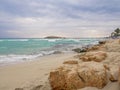 Beautiful Nissi beach with rolling sea with waves on a cloudy murky day in Ayia Napa, Cyprus Royalty Free Stock Photo