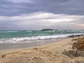 Beautiful Nissi beach with rolling sea with waves on a cloudy murky day in Ayia Napa, Cyprus Royalty Free Stock Photo