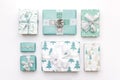 Beautiful nordic christmas gifts isolated on white background. Turquoise colored wrapped xmas boxes. Gift wrapping.