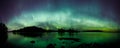 Beautiful northern lights over lake panorama