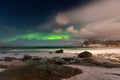 Beautiful Northern Lights in Lofoten Island in Norway. Aurora Boreal over the beach. Majestic green night sky.  Nightscape full of Royalty Free Stock Photo