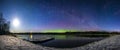 Beautiful Northern Lights panorama with Milky Way and the Moon