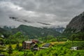 Beautiful Norway forest landscape with small village in the valley surrounded by green hills and mountain Royalty Free Stock Photo