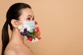 Beautiful nude asian girl in floral face mask Royalty Free Stock Photo