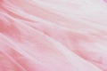 Beautiful nude pink tulle with shiny beads background. Draped background of pink powdery fabric, texture Royalty Free Stock Photo